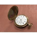 A late Victorian gold plated Waltham pocket watch with foliate scrolled decoration to case, the