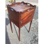 A Georgian mahogany tray-top night stand, the top with arched gallery rails and heart shaped handles