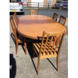 A mid-century G-plan teak dining room table & chair set, the table with rounded ends having integral