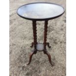 A circular tray-top mahogany occasional table by Chas Walker & Sons of Harrogate, the top on four