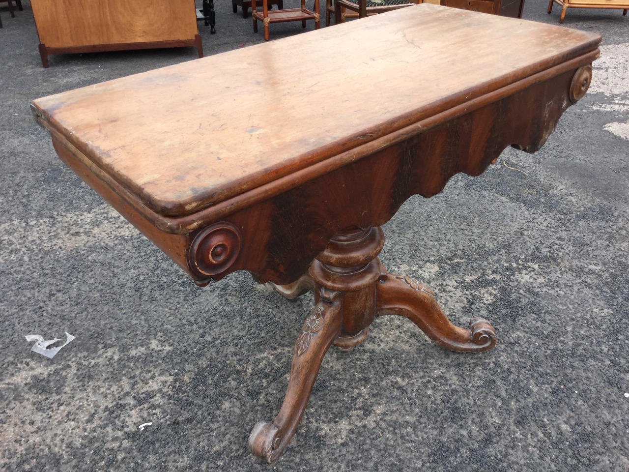 A Victorian mahogany turn-over-top tea table, the rounded twin top above a shaped apron with applied - Image 2 of 3