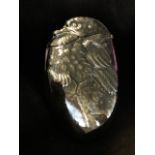 A silver plated vesta case, the oval box embossed as a chick emerging from an egg, with sprung