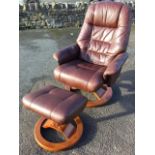 A Stressless leather upholstered chair & footstool, the adjustable seat with stitched panelled