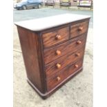 A Victorian mahogany chest of drawers, the rectangular rounded top above the short and three long