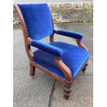 A Victorian mahogany upholstered armchair, the padded back in moulded frame above a sprung seat, the