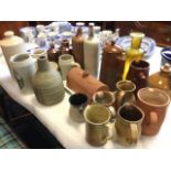 Miscellaneous ceramics including a collection of studio pottery jugs, steins, a cider bottle,