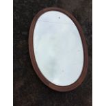 A large Edwardian mahogany mirror with bevelled plate in moulded frame, inlaid with chequered