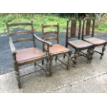 A pair of oak chairs with press carved rectangular splats above drop-in upholstered seats raised