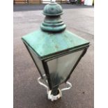 A Victorian copper streetlight, the square tapering lantern with glazed panels - one opening as a