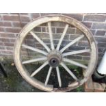 A 3ft Victorian cart wheel with thick cast iron rim and oval tapering ash spokes around a heavy