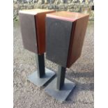 A pair of teak Sabre hi-fi speakers by Ruark Acoustics, the cases on rectangular metal columns