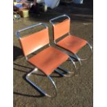 A pair of modernist Van de Rohe style cantilever chairs with leather backs & seats on tubular chrome
