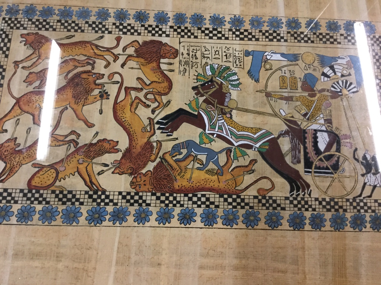 A pair of Egyptian papyrus style paintings, hunting lions and King Tutankhamen etc, the signed - Image 2 of 3