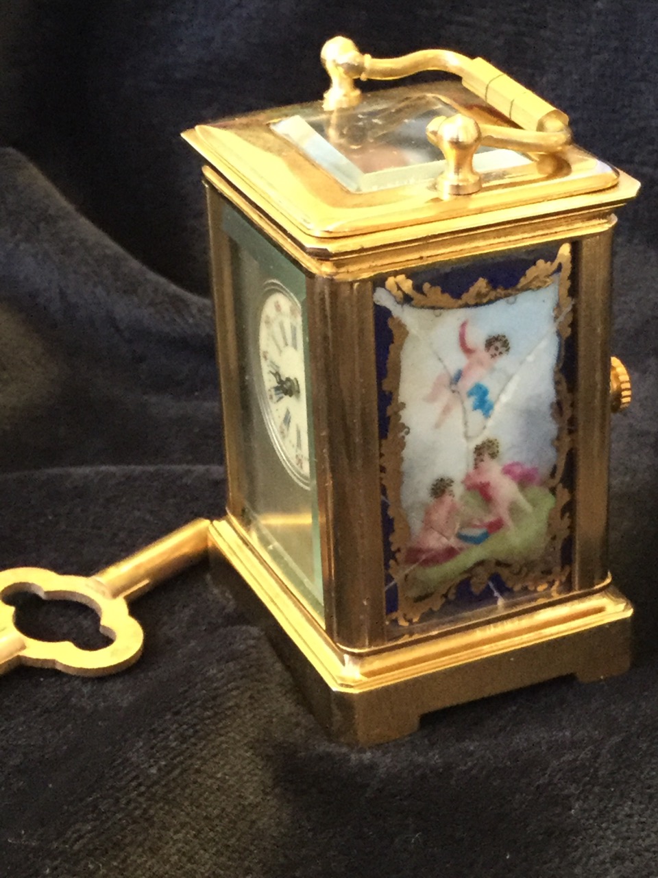A miniature brass carriage clock mounted with Sevres style panels decorated with cherubs, the - Image 3 of 3