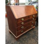 A George III mahogany bureau, the cleated fallfront enclosing a fitted interior with eight small
