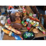 A collection of painted and carved wood pieces including Russian dolls, boxes, animals, trays,