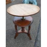 A late nineteenth century mahogany rise-and-fall occasional table, the circular top with