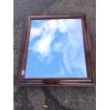 A Victorian rosewood framed mirror, the later plate in cushion moulded frame. (27.5in x 24.25in)