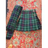 A Duncan pattern pleated tweed kilt & plaid, with leather straps & chrome buckles. (2)