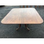 A nineteenth century mahogany breakfast table, the rectangular rounded top with ribbed edge on