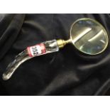 A table magnifying glass, the lens in brass mount having tapering shaped diamond cut glass