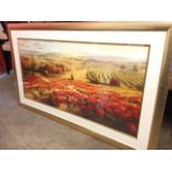 Lombardi, a large landscape print titled Poppy Panorama, mounted and in gilt cushion frame. (56.75in