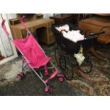 A Victorian style Lugano pram with concertina hood and spoked wheels, complete with a dressed
