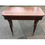 A nineteenth century mahogany turn-over-top tea table, the rounded moulded leaves above a plain
