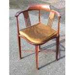 An Edwardian mahogany corner armchair, the back inlaid with boxwood & ebony stringing having