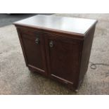 A Philips oak cased hostess trolley with sliding top revealing glass tureens & covers, having