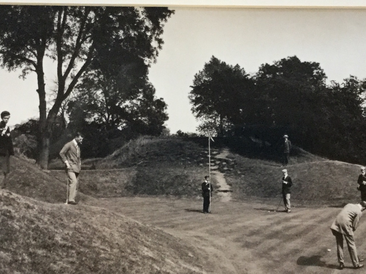 A pair of monochrome wide-angled photographs of golfers from the Edwardian era, the shadowed sepia - Image 2 of 3