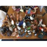 A collection of animal figurines - ceramic including Beswick, handpainted, resin, carved, African