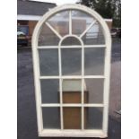 A painted arched window with fourteen panes. (36in x 64in)