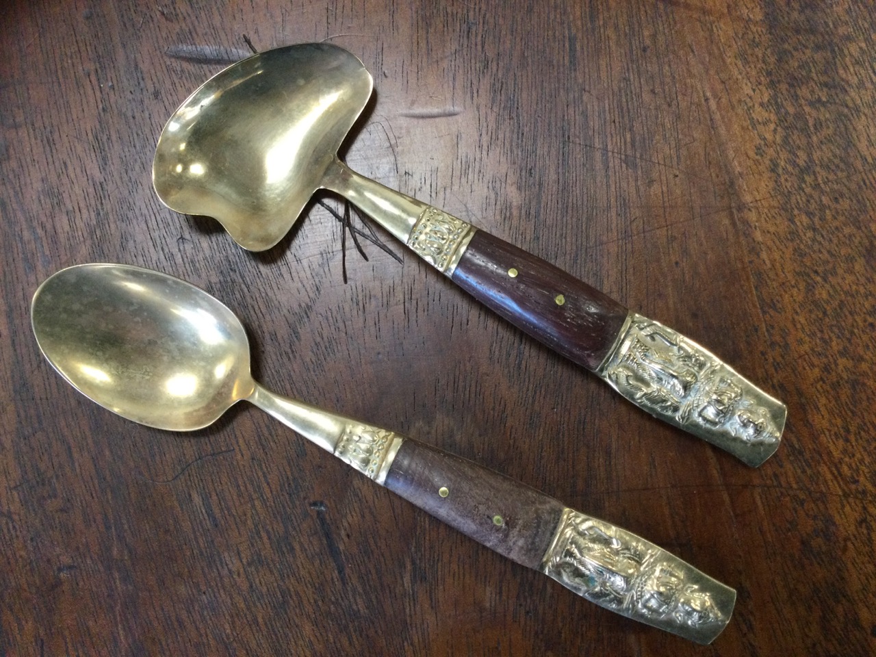 Two cased sets of eastern brass cutlery, the boxes each with trays, the pieces having embossed - Image 3 of 3