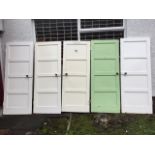 A set of five painted panelled doors, each with four moulded panels. (29.75in x 77.5in) (5)