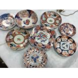 Miscellaneous nineteenth century Imari bowls & plates decorated in the traditional brick red and