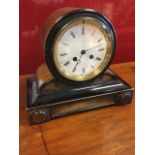 A Victorian walnut mantleclock raised on plinth with ebonised mouldings, the drum case, with
