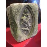 An ancient carved stone, the rectangular block with elliptical floral panels. (7.5in x 7in x 10in)
