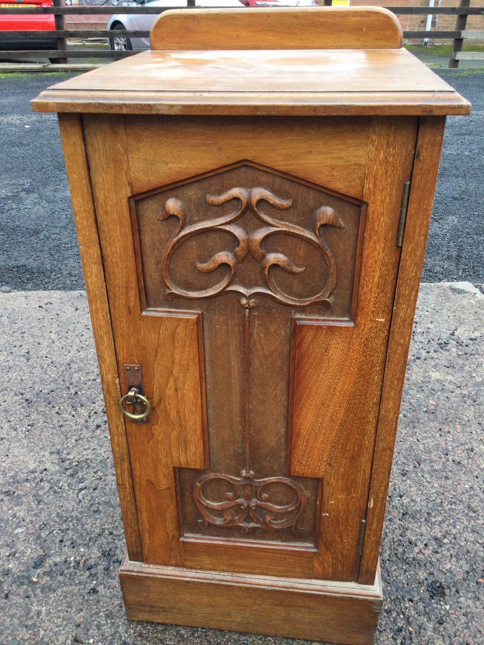 An art nouveau mahogany pot cupboard with moulded top above a scroll carved panelled door mounted - Image 2 of 3