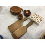 A mouseman carved oak octagonal napkin ring; a pair of ribbed butterpats; two leather cased tape