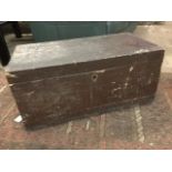 A rectangular Victorian dovetailed pine box with iron carrying handles to ends, mounted with oval
