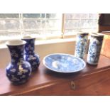 A nineteenth century Japanese bowl decorated with blossom foliage, the back with three leaf