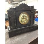 A Victorian polished slate mantleclock, the architectural style case with marble columns and