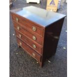 A small nineteenth century mahogany chest with rosewood top above four cockbeaded drawers mounted