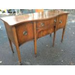 A serpentine fronted mahogany sideboard, the top with boxwood & ebony line inlay above a central