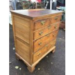 A Georgian country oak chest of drawers, the rectangular top above two short and three long