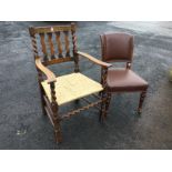 An oak armchair with waved slats framed by barleytwist columns, with shaped arms above rush seating,