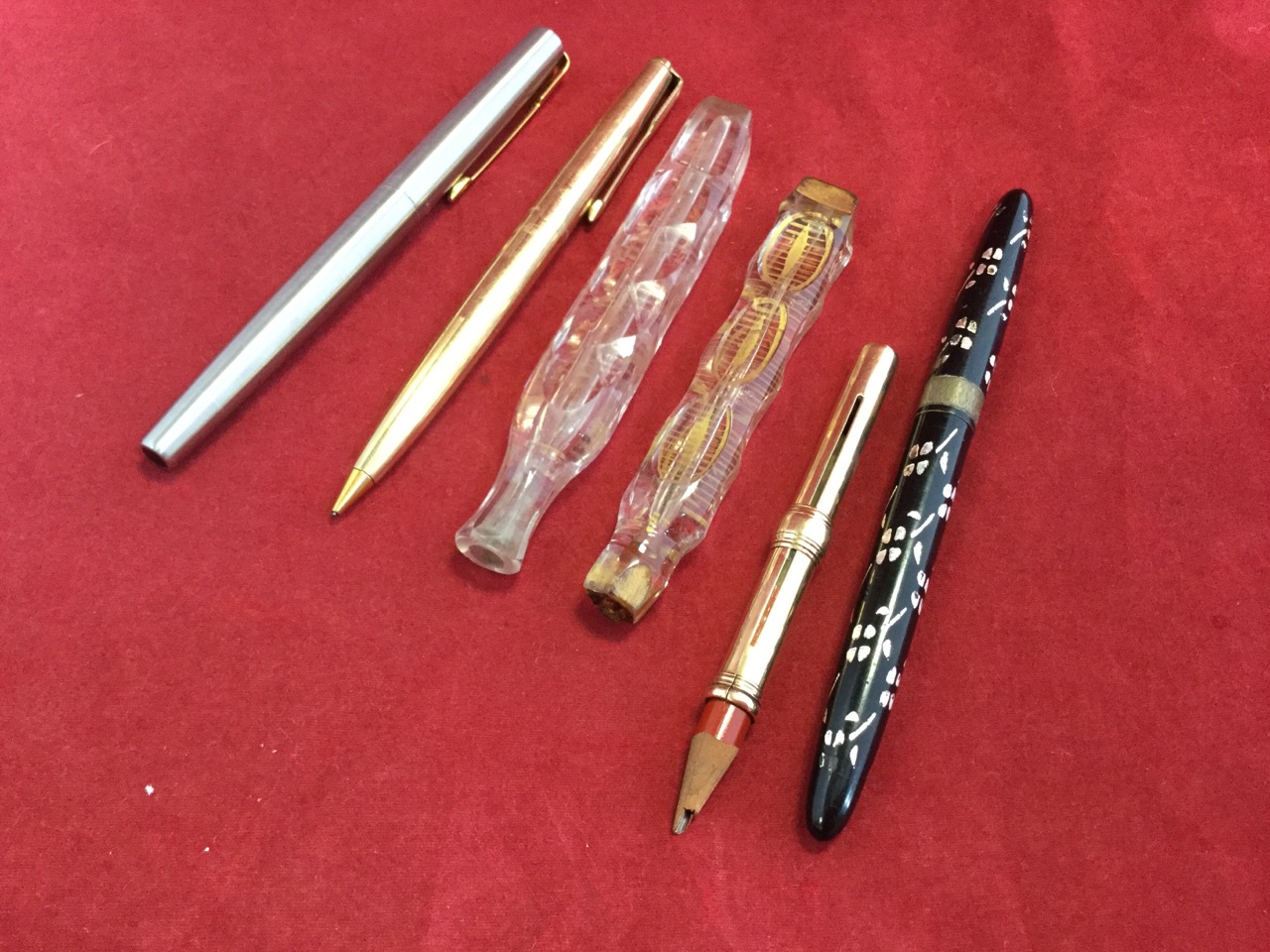 A gold pencil case - rubbed marks; a rolled gold Parker 61/65 propelling pencil; a Sheaffers