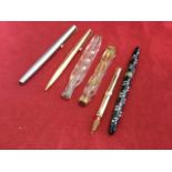 A gold pencil case - rubbed marks; a rolled gold Parker 61/65 propelling pencil; a Sheaffers