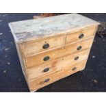 A Victorian pine chest of drawers, the rectangular moulded top above two short and three long